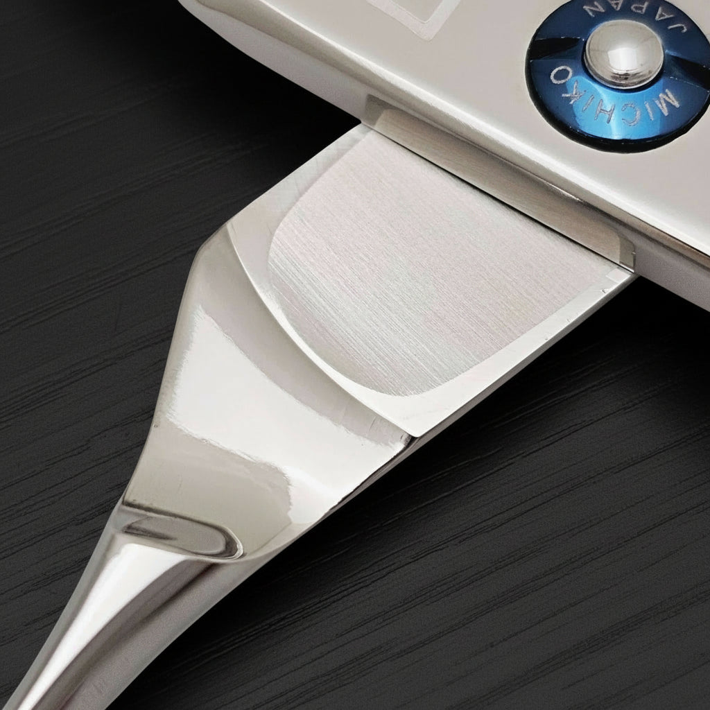 Close-up of a pair of hair scissros on a white background