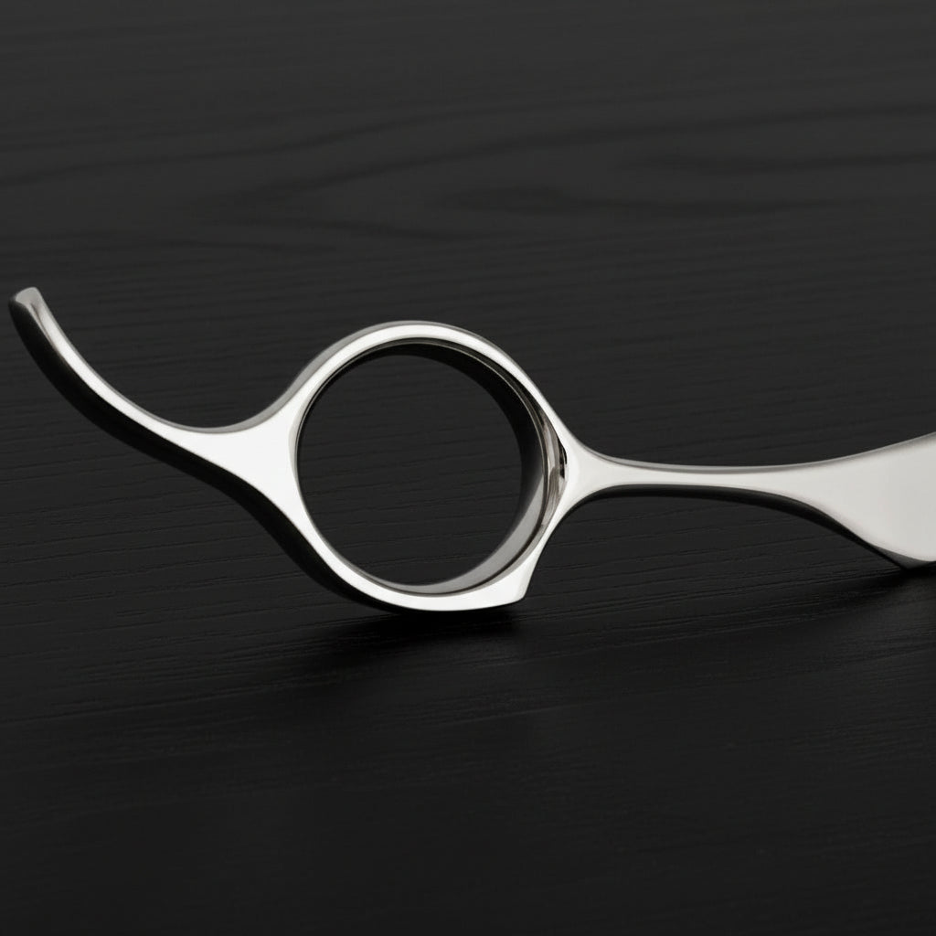 Metallic hairdressing shears on a white background