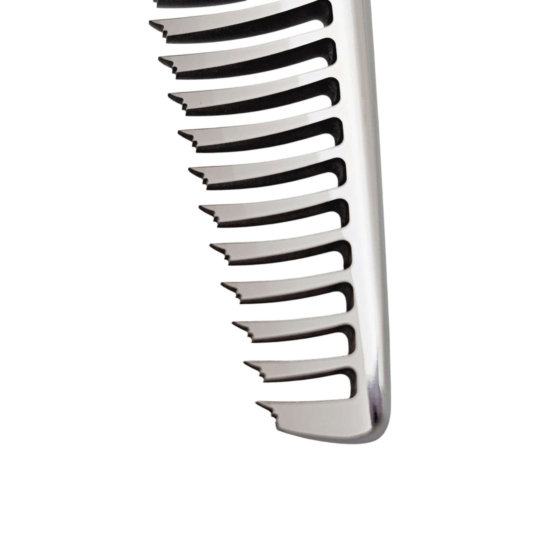 Close-up of metallic teeth from the hair thinning shears on a white background