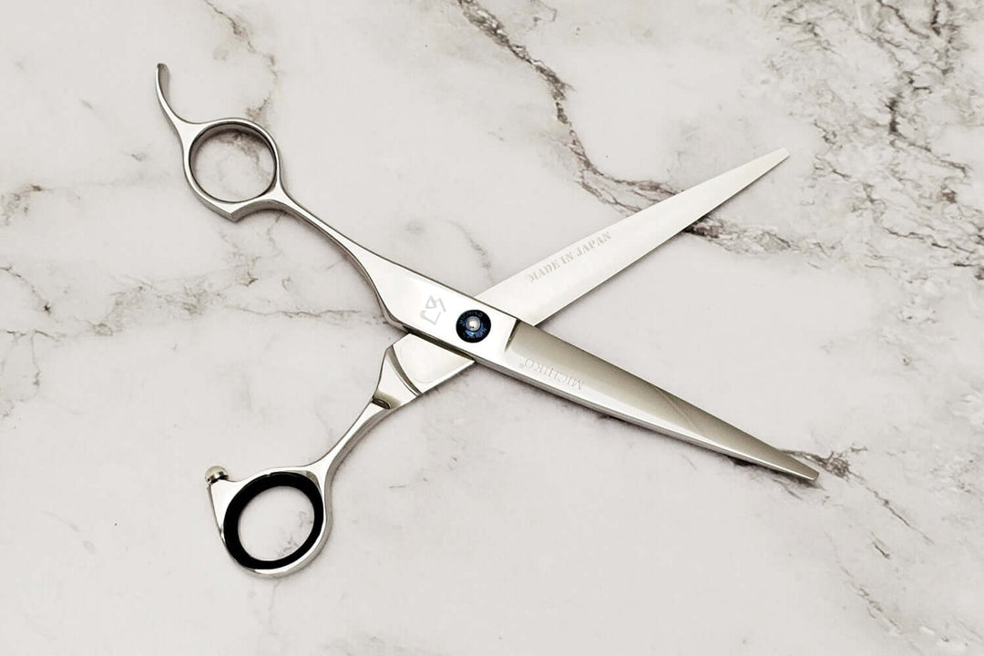  Lefty hair scissors on a marble surface