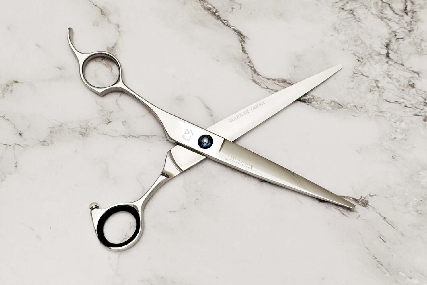  Lefty hair scissors on a marble surface