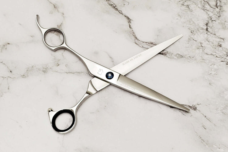  Lefty hair scissors on a marble surface