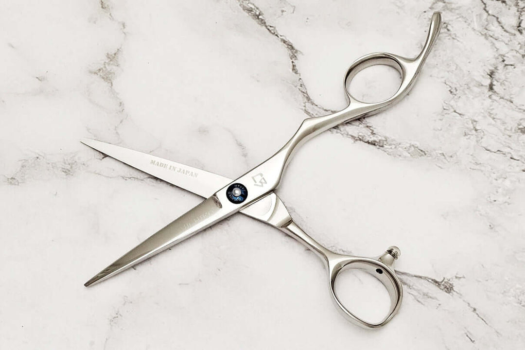 Barber shears on a marble surface