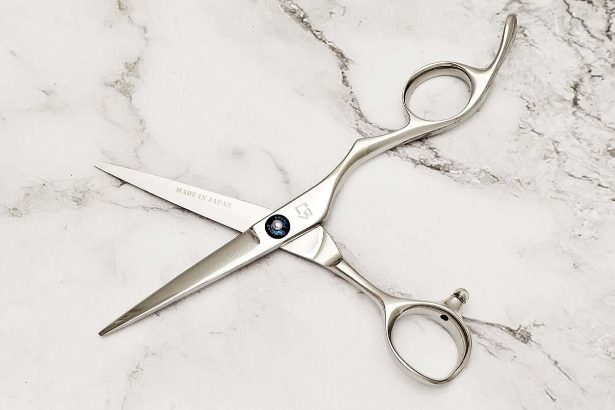 Barber shears on a marble surface
