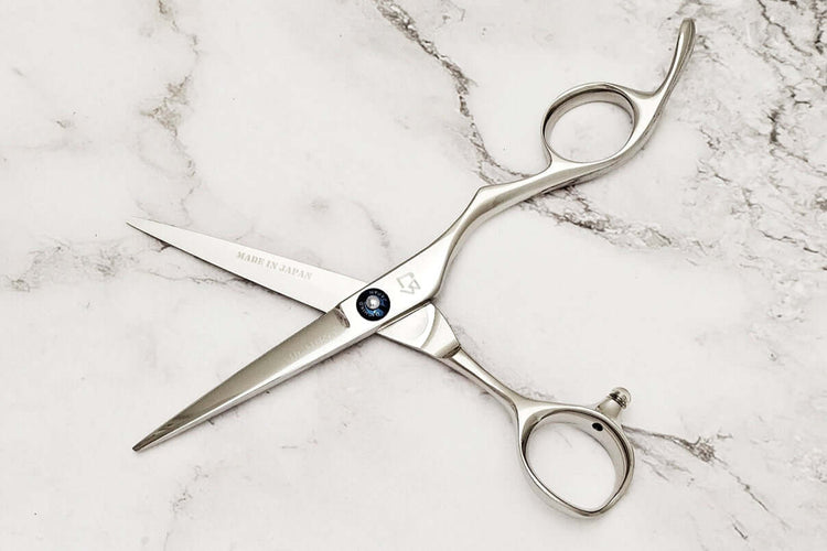 Barber shears on a marble surface