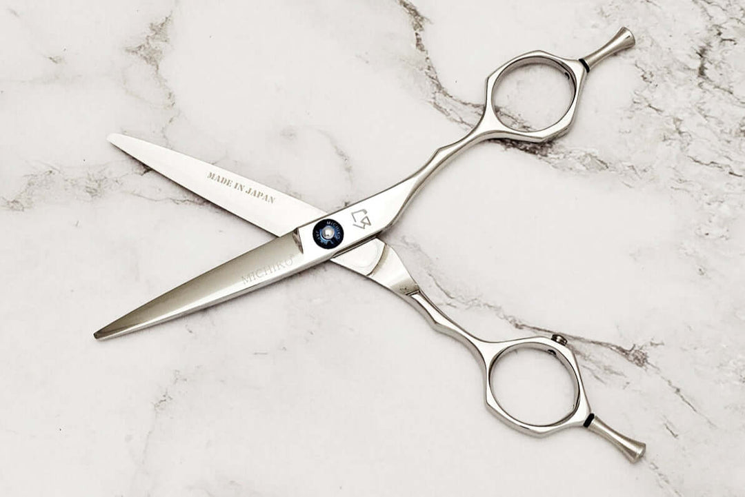 Hair shears on a marble surface