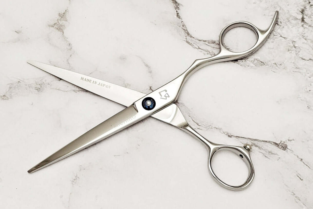 KT 6.5" barber shears on a marble surface