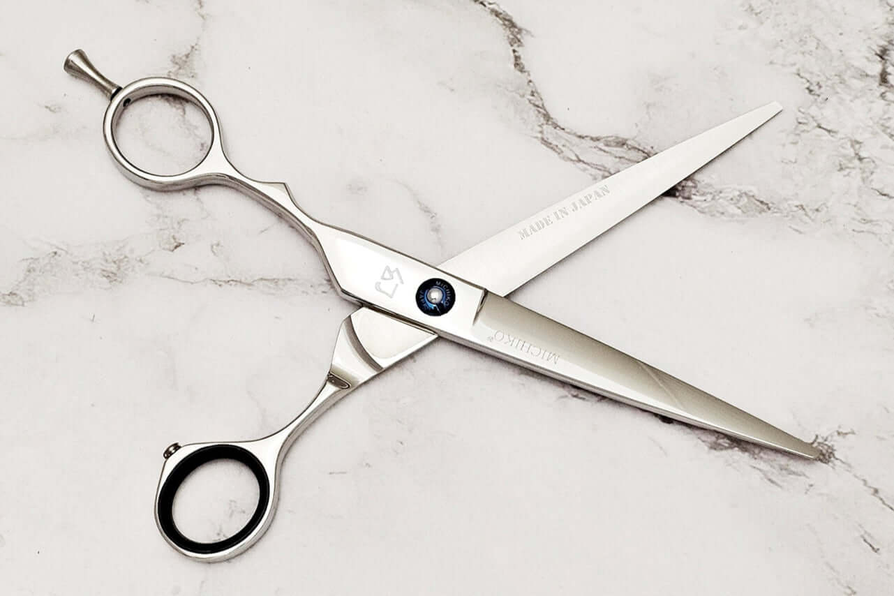 Lefty hair shears on a marble surface