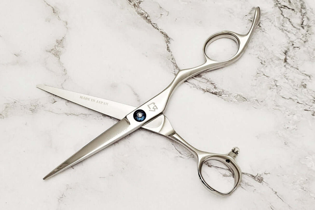 Barber shears on a marble surface