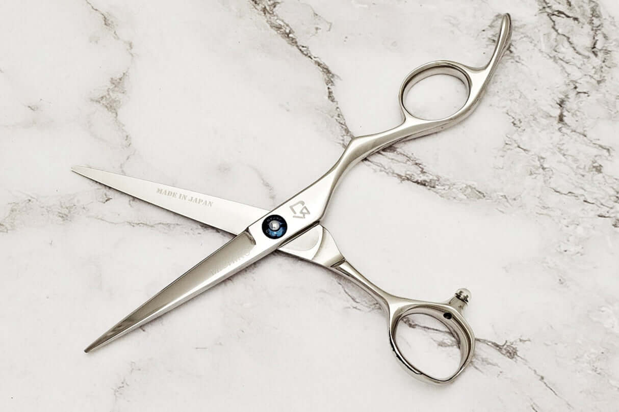 Barber shears on a marble surface