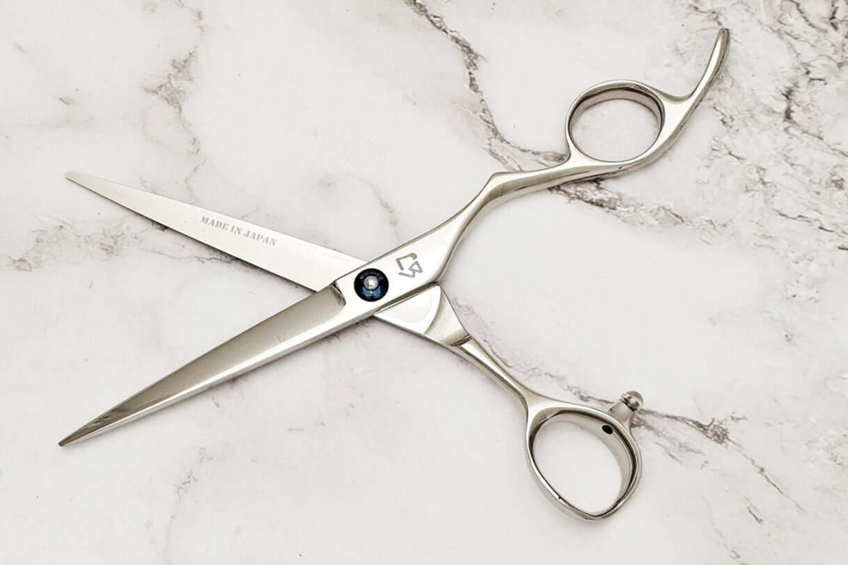 Barber shears on a marble surface