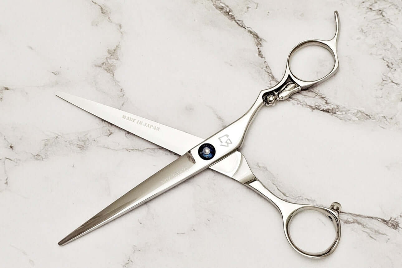 Cat Handle Hair Cutting Scissors on a marble surface