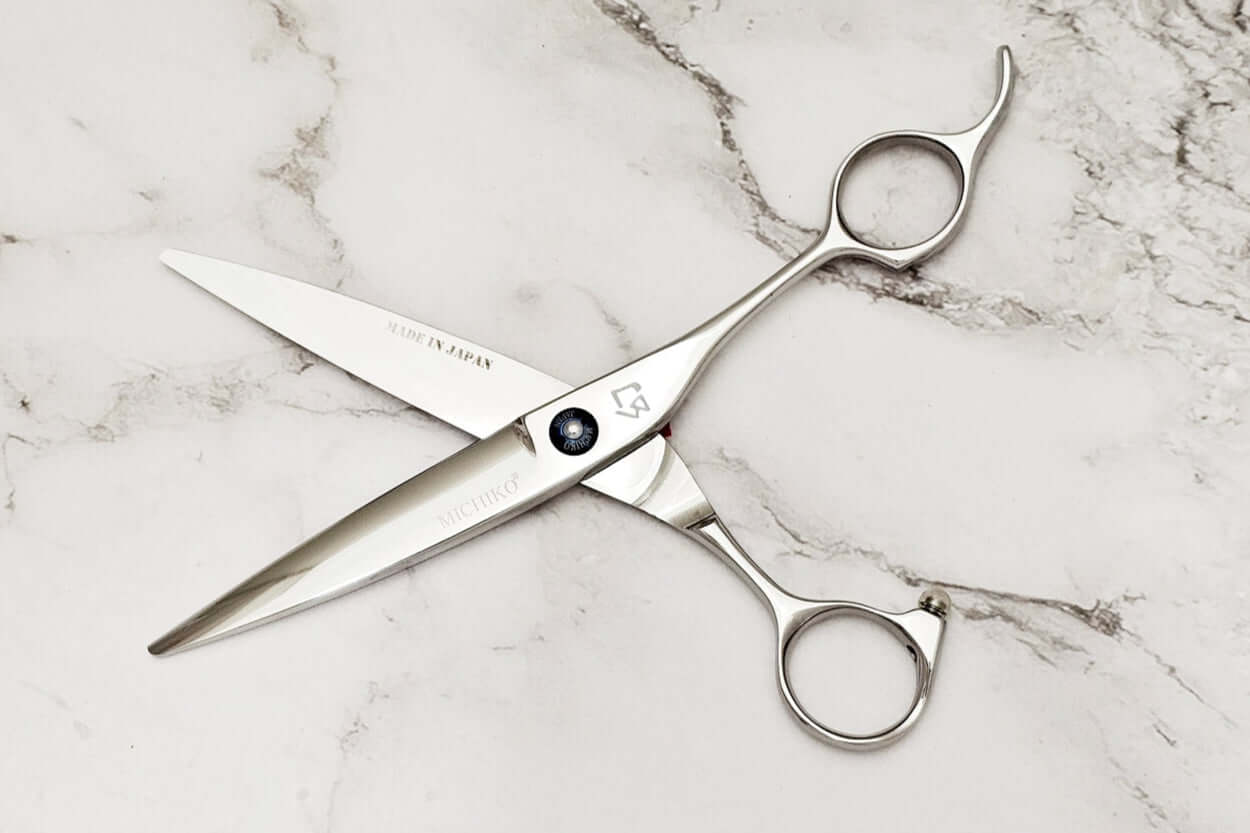 Hair scissors on a marble surface