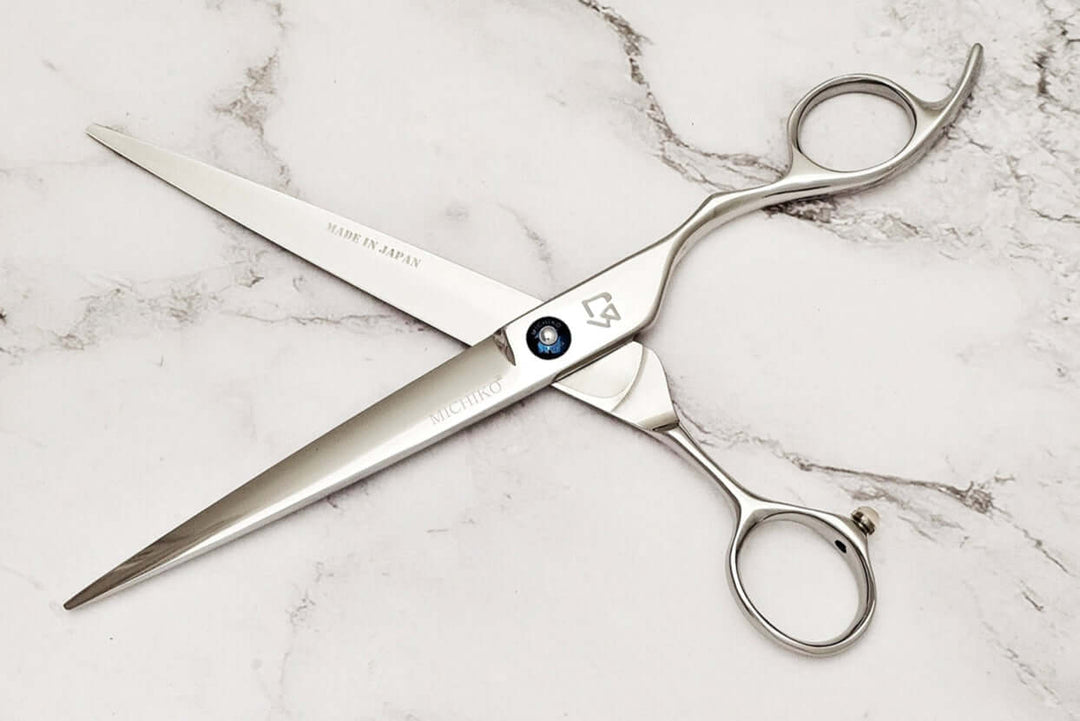 Cobalt alloy 7.5" barber shears on a marble surface