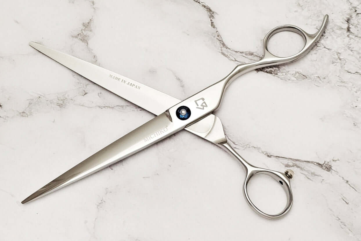 Cobalt alloy 7.5" barber shears on a marble surface