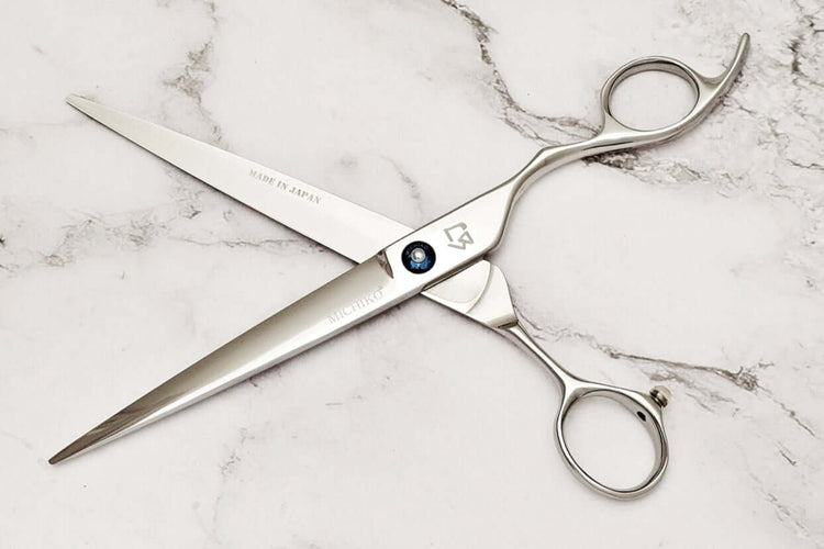 Cobalt alloy 7.5" barber shears on a marble surface