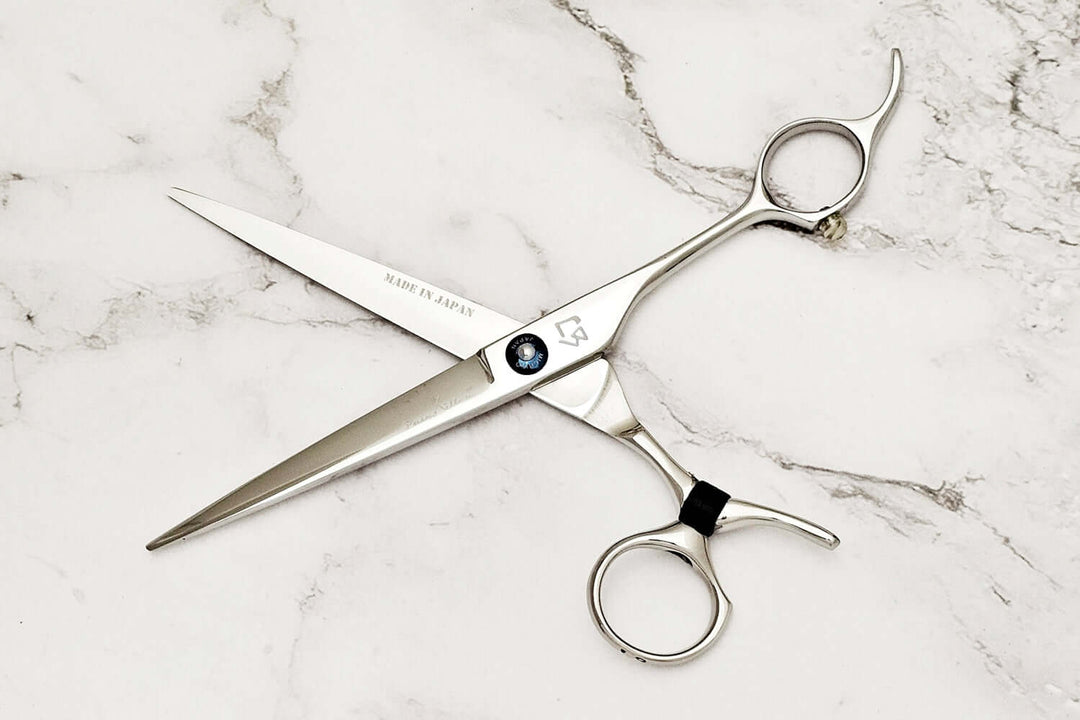 Swivel hair cutting scissors on a white background