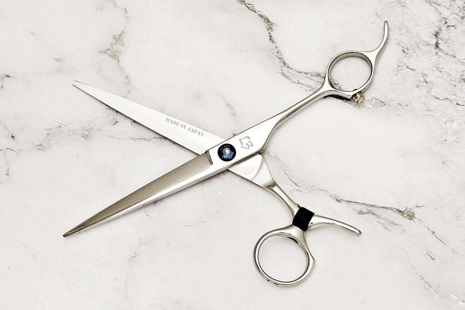 Swivel hair cutting scissors on a white background