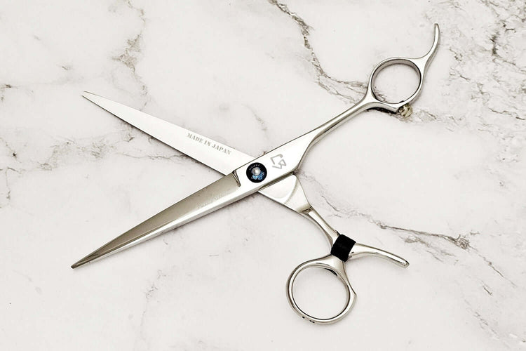 Swivel hair cutting scissors on a white background