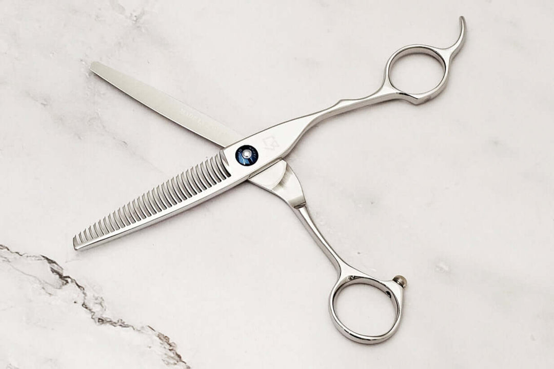 Crane handle hair thinner on a marble surface