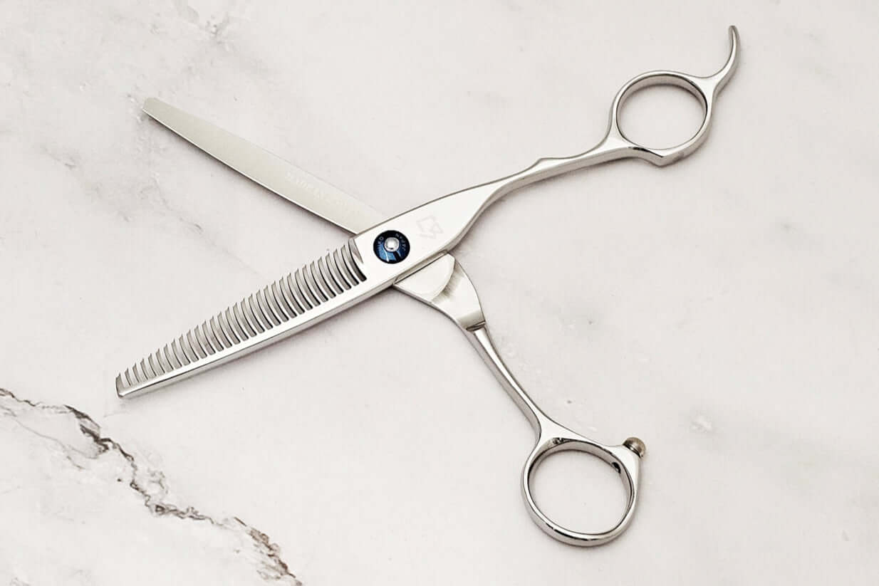 Crane handle hair thinner on a marble surface