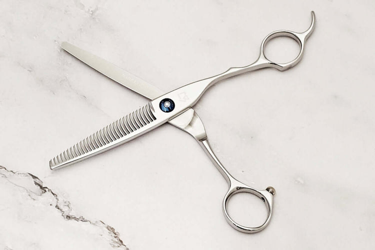 Crane handle hair thinner on a marble surface