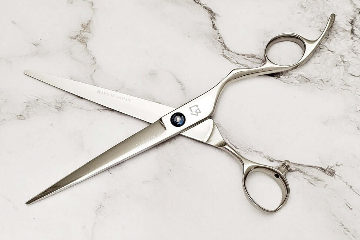 Barber shear KM 7.0 on a marble surface