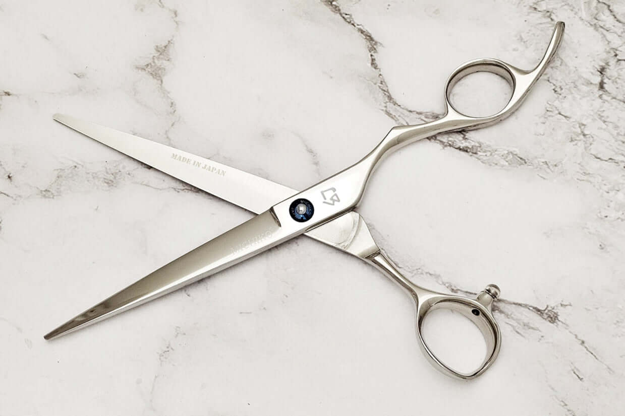 Barber shears on a marble surface