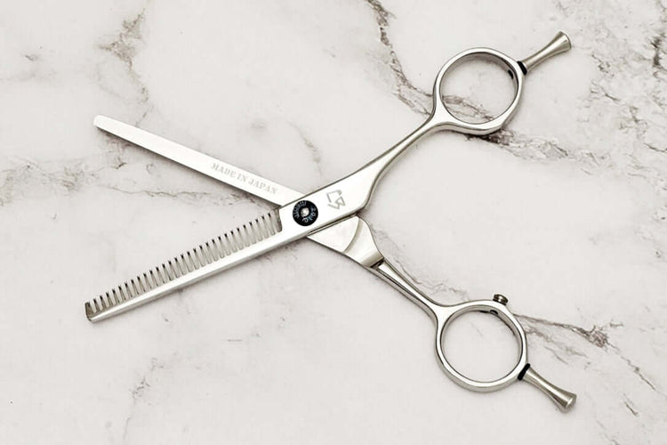 Hair thinning scissors on a white background