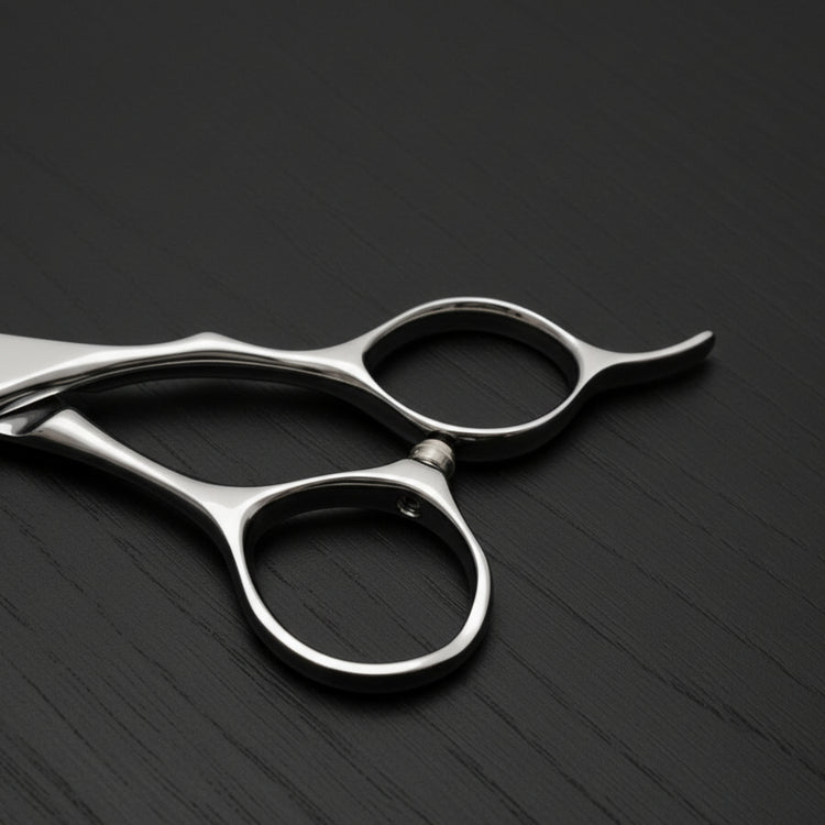 Silver hair scissors on a black background