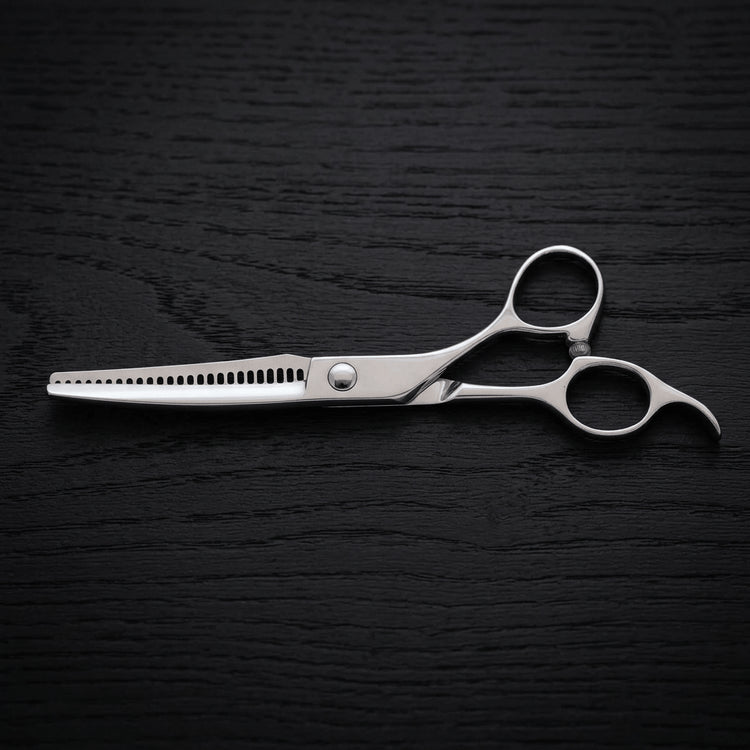 Hair thinning shears on a black background.