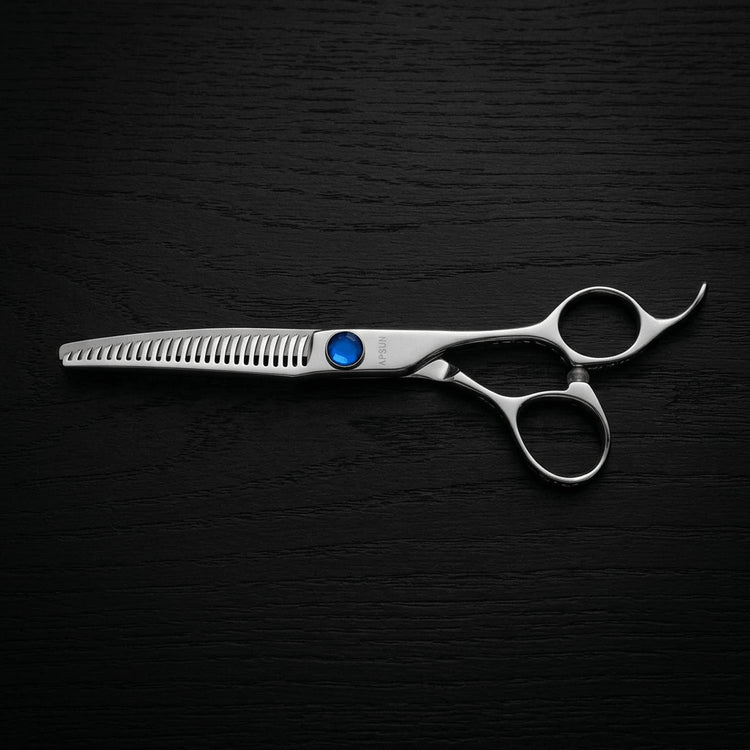 Hair thinning shears on a black background.
