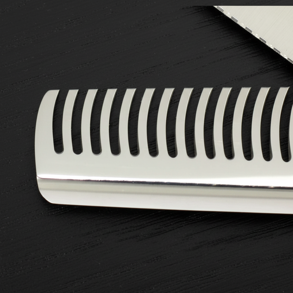 Close-up of hair thinning shears theeth blade on a black surface