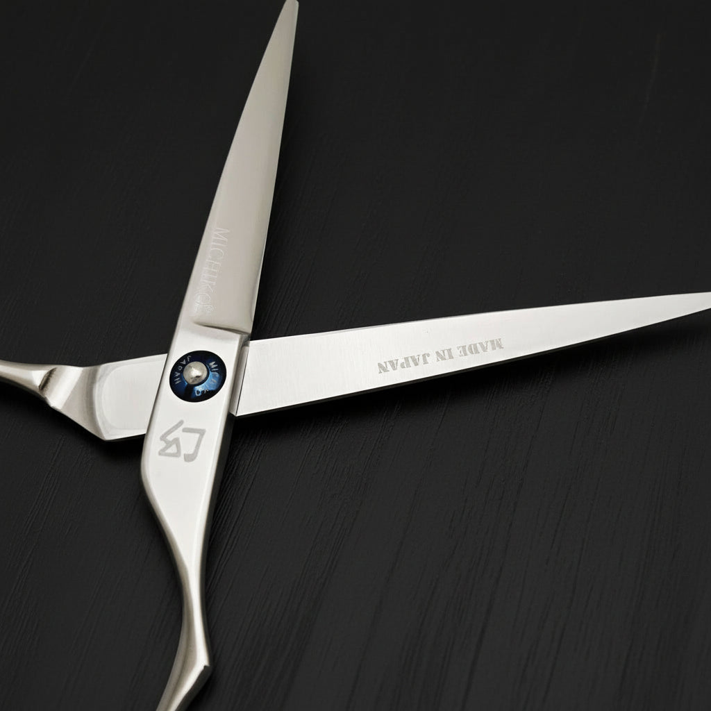 Silver scissors with 'Made in Japan' branding on a white background