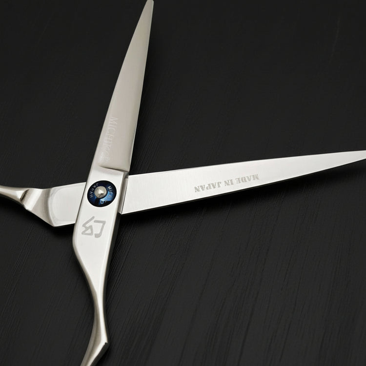 Silver scissors with 'Made in Japan' branding on a white background