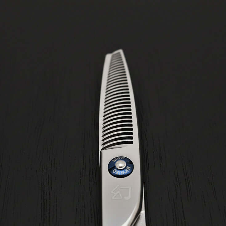 Lefty hair thinning shears with brand logo on a light gray background
