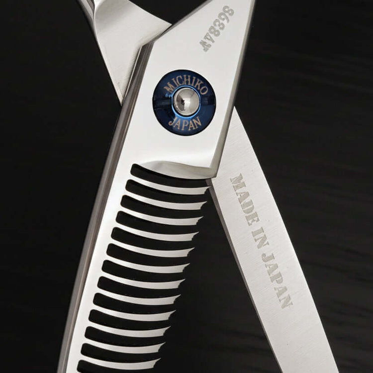 Close-up of a pair of scissors with 'Michiko Japan' branding on a black background