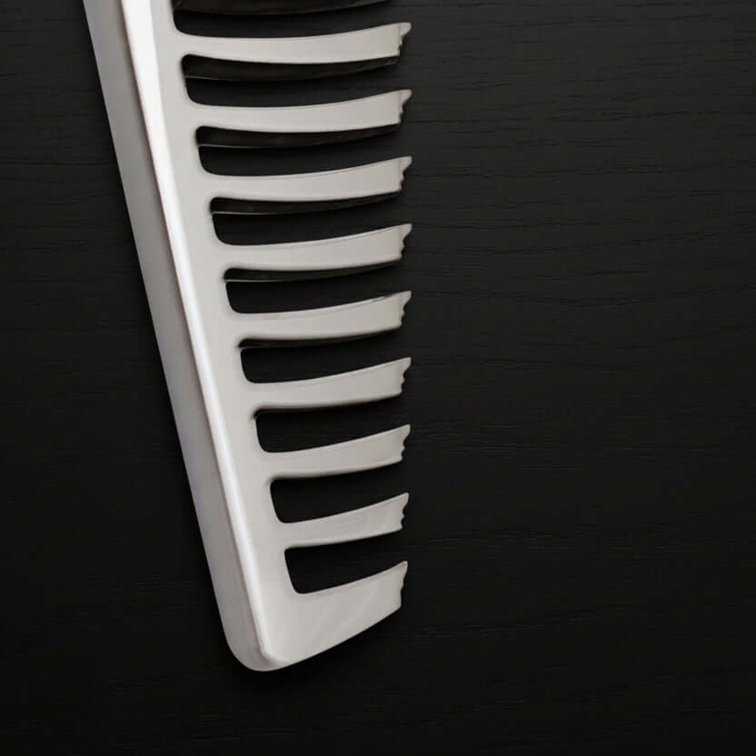 Close-up of thinning shears teeth part on a black background