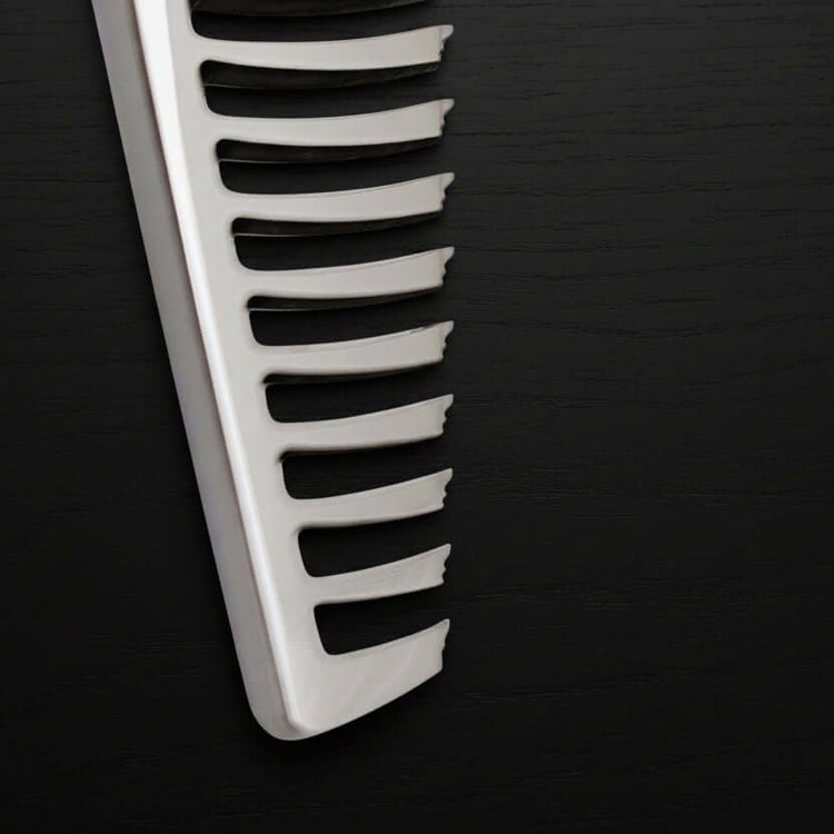 Close-up of thinning shears teeth part on a black background