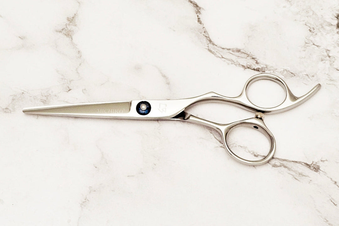 Michiko Select MK 5.5 scissors on a marble surface