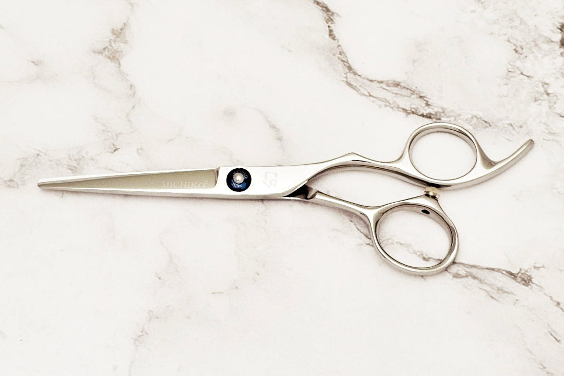 Michiko Select MK 5.5 scissors on a marble surface