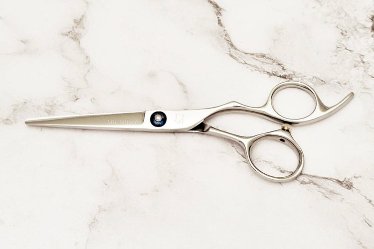 Michiko Select MK 5.5 scissors on a marble surface