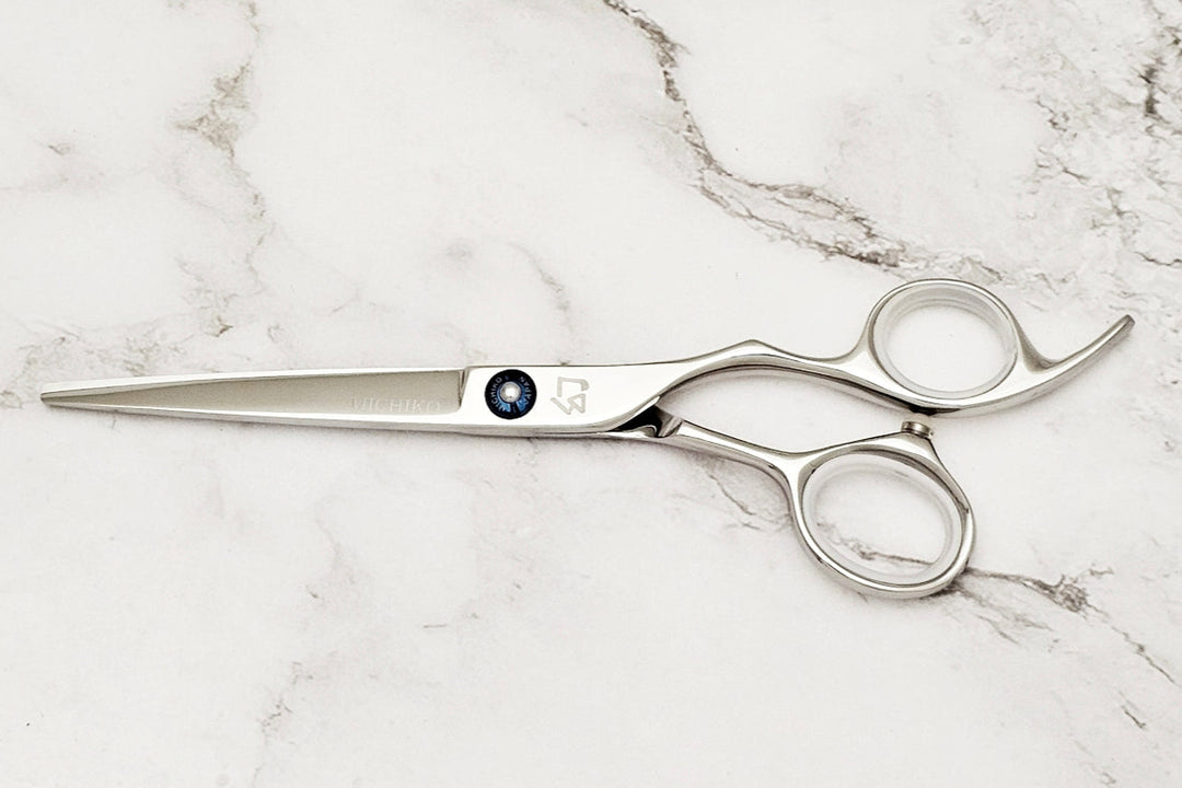 Michiko Select MK 6.0 scissors on a marble surface