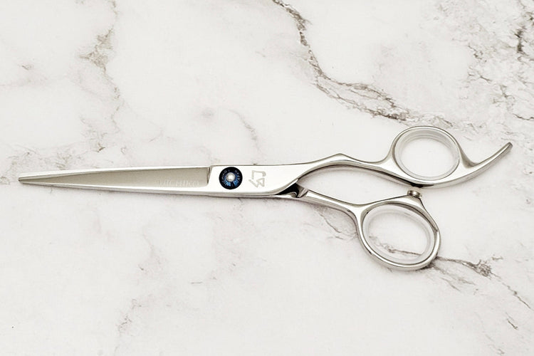 Michiko Select MK 6.0 scissors on a marble surface