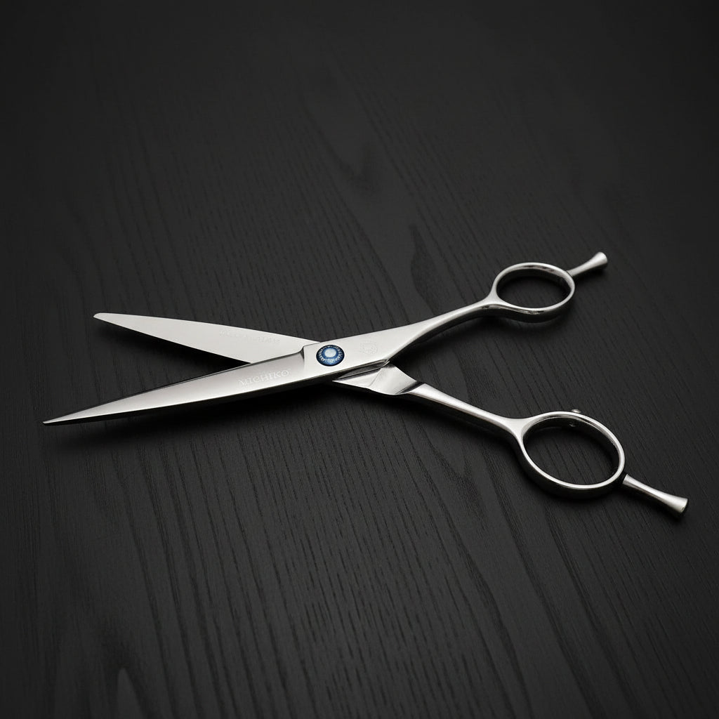 Stainless steel hair cutting shears on a black background
