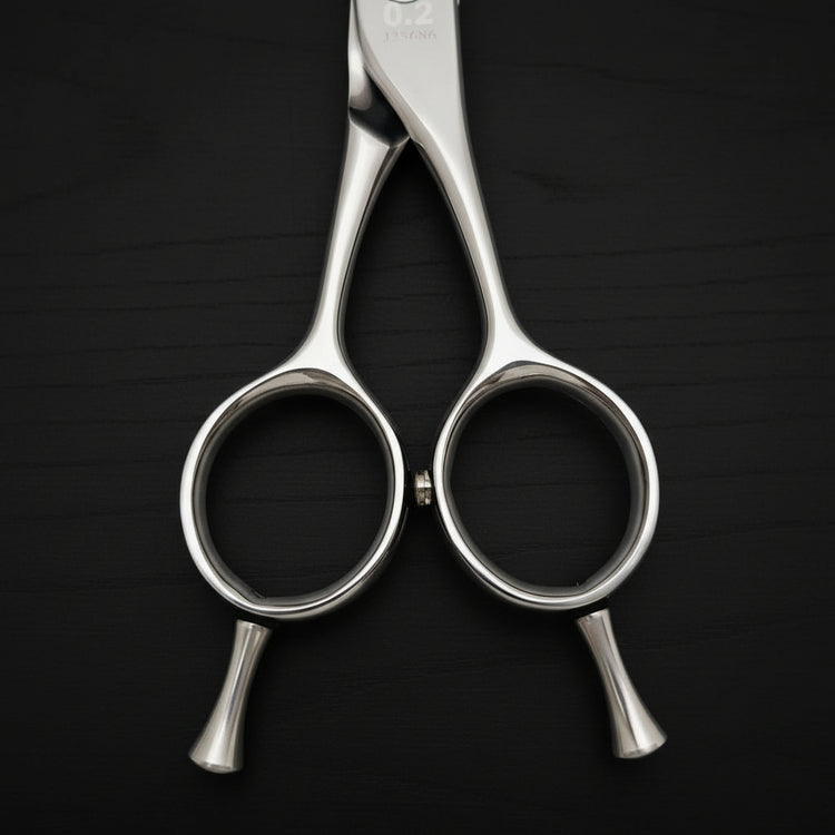 Hair cutting shears on a black background