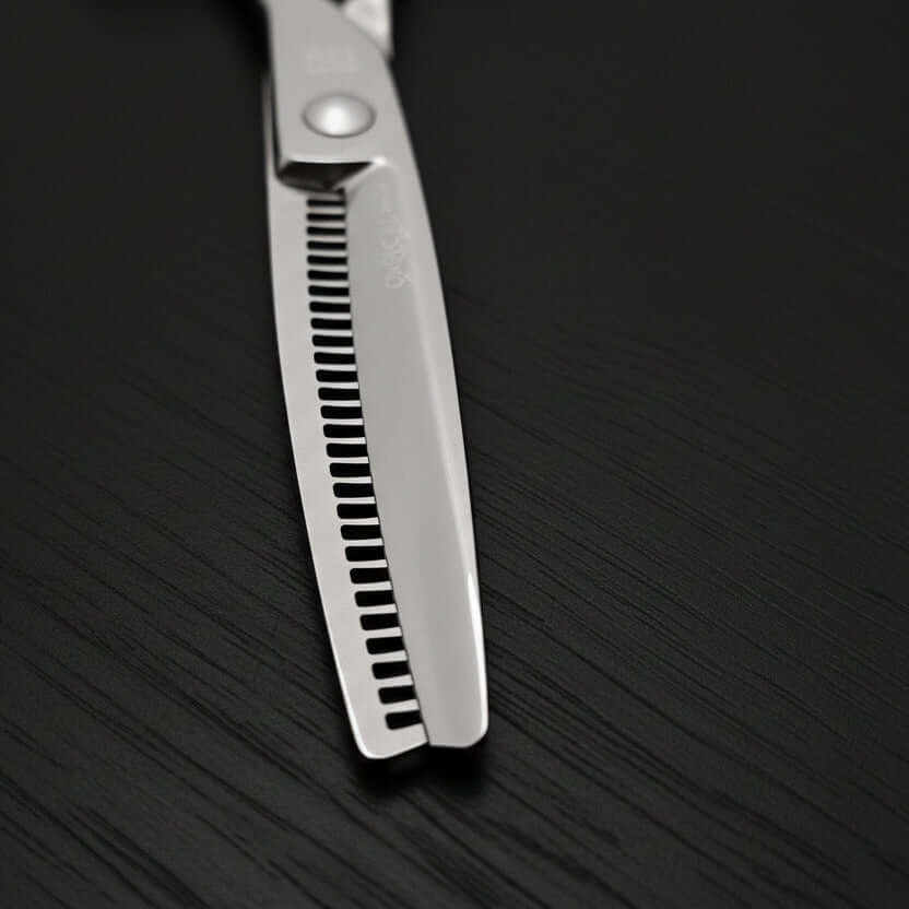 Close-up of hair-thinning shears blades on a black background