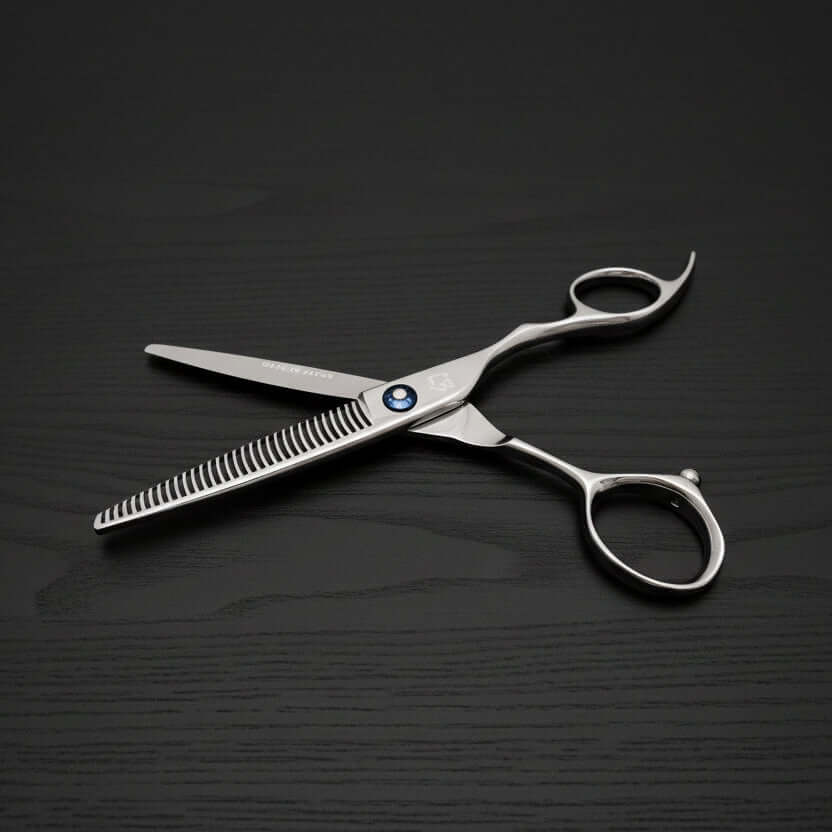 Hair cutting scissors on a black background