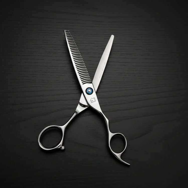 Hair cutting scissors with a brand logo on a black background