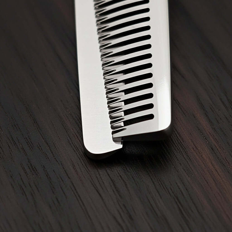 Close up of hair thinner tip part on a dark wooden surface